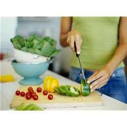 Woman chopping vegetables for salad.JPG